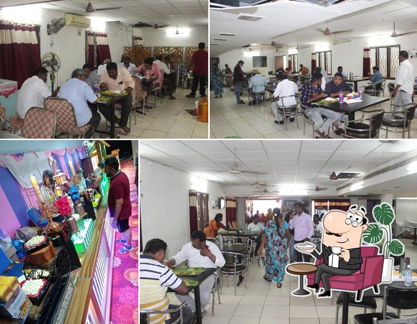 Take a seat at one of the tables at Dwaraka Mess & Tiffins