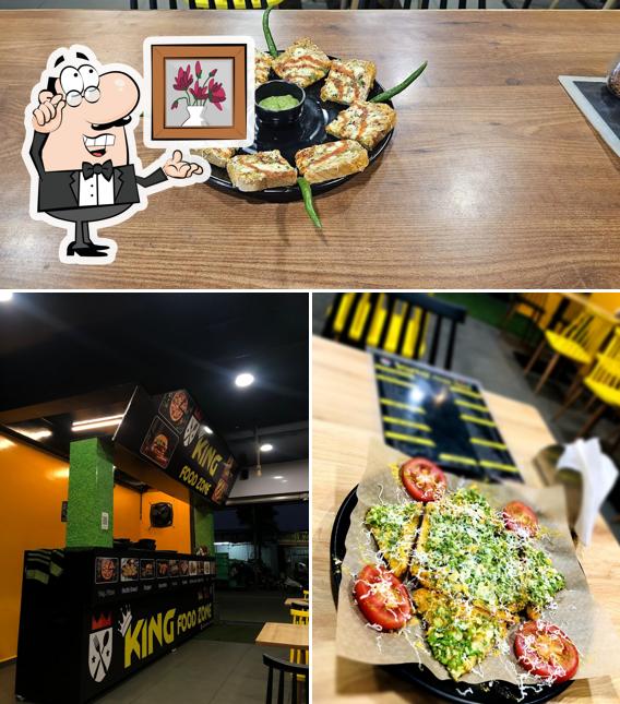 Take a look at the image showing interior and food at King Food Zone
