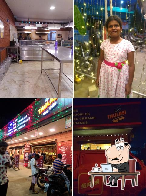 Take a seat at one of the tables at Thulasi Veg Cafe