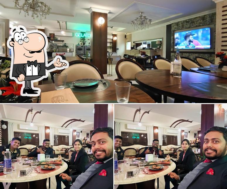 Take a seat at one of the tables at Aman Chicken (Aman's)