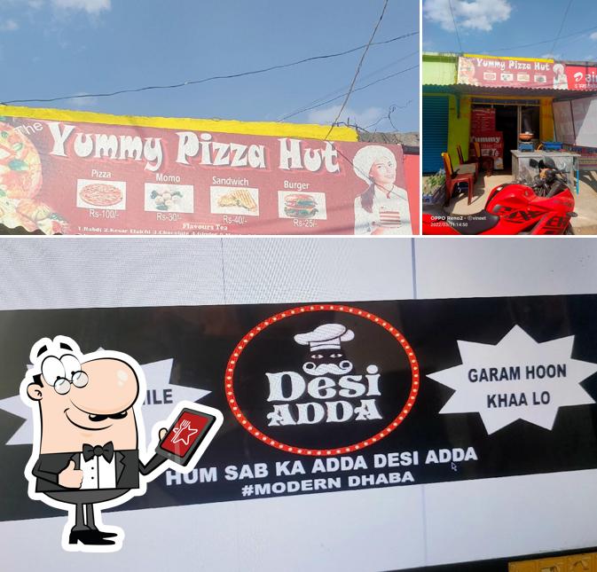 The exterior of The Yummy Pizza Hut