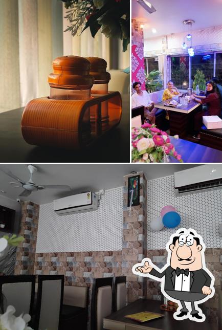 Take a seat at one of the tables at The Mast Guest House in Jalukbari