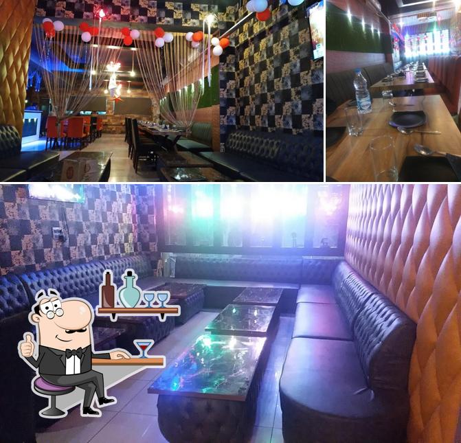 Take a look at the photo displaying interior and dining table at Urban Kitchen ( A Family Restaurant )