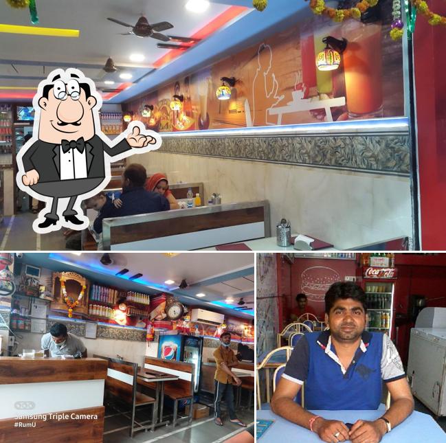Take a seat at one of the tables at Aahar Fast Food - Best Fast Food in Daman