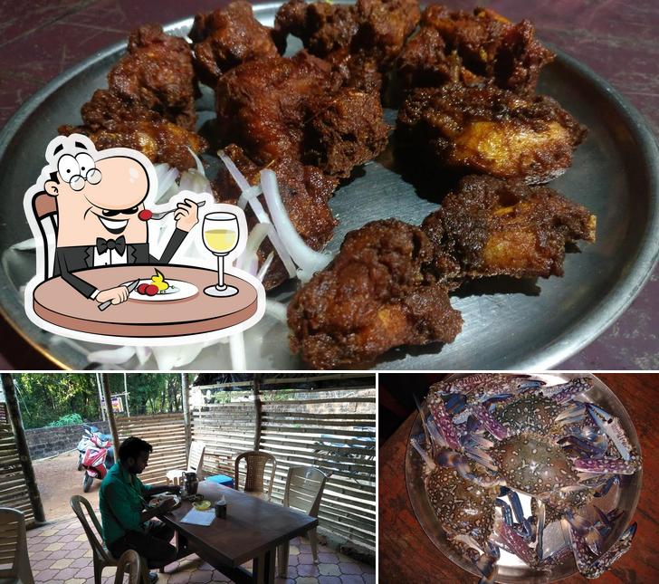 Check out the photo depicting food and interior at Open House Fish Land. IB Road om beach cross