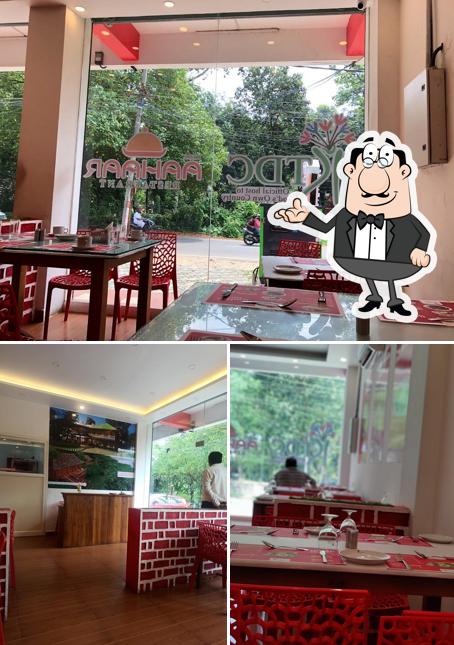 Take a seat at one of the tables at KTDC Aahaar Restaurant