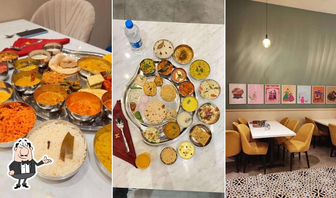 Take a seat at one of the tables at Manbhavan Premium Thali Restaurant
