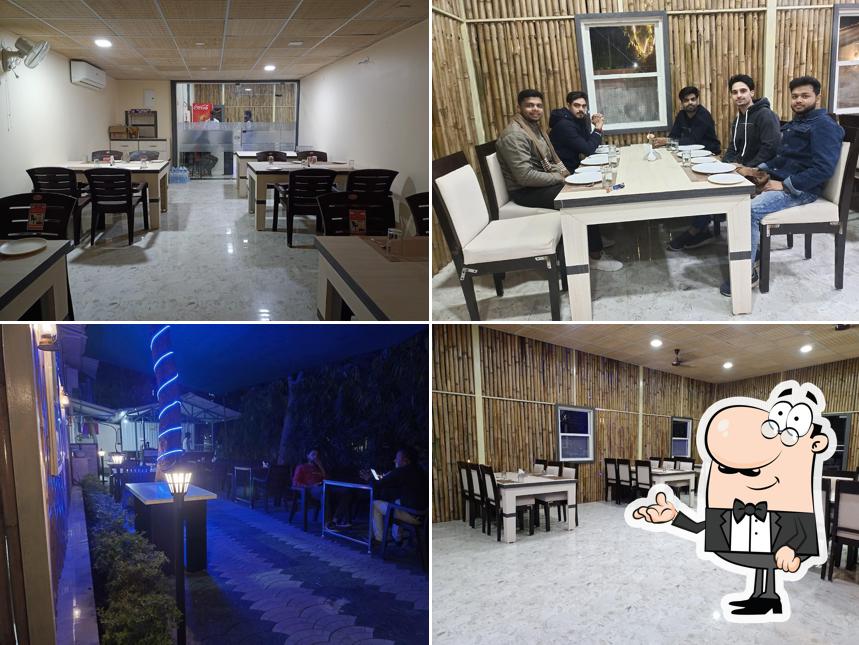 Take a seat at one of the tables at Sudama kuti