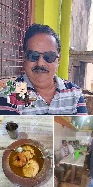 Take a seat at one of the tables at Dwaraka hotel