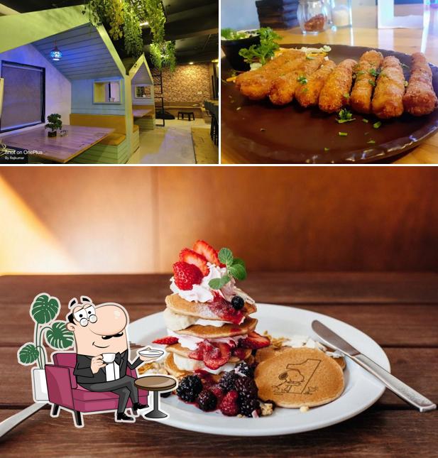 Take a look at the picture displaying interior and food at The SiRaRa Cafe