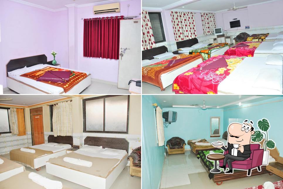 Take a seat at one of the tables at HOTEL SAI SAGAR SHIRDI