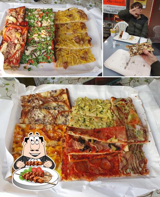 Tra le diverse cose da Pizza In di Moroni Lorella & Mengoni Graziano si possono trovare la cibo e interni