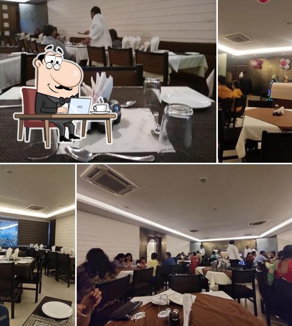 Take a seat at one of the tables at Hotel Rajasthan