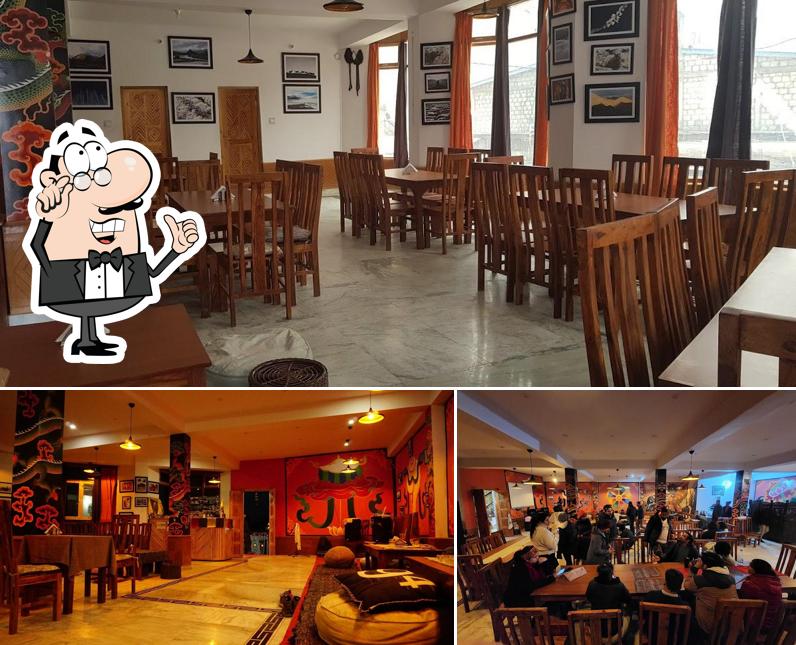 Take a seat at one of the tables at Cafe Zomsa Kaza Take a seat at one of the tables at Cafe Zomsa Kaza