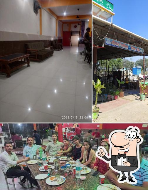 Take a seat at one of the tables at Deepak Restaurant, Fatehpur