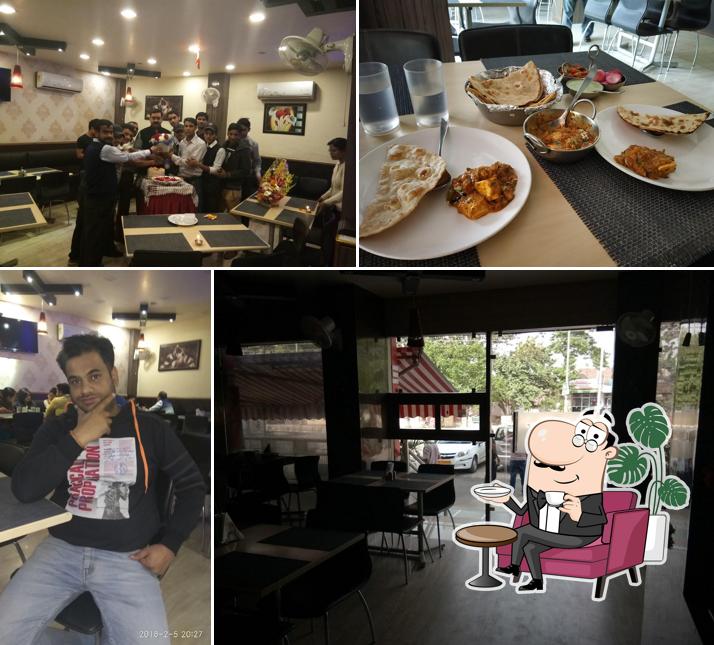 Take a seat at one of the tables at Krishnam Restaurant