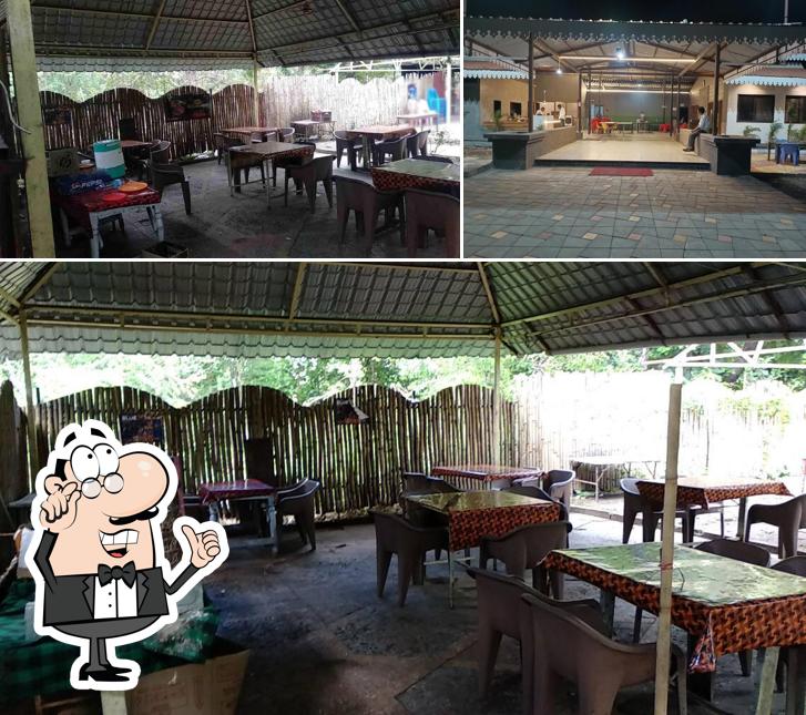 Take a seat at one of the tables at Mohini Bar And Restaurant