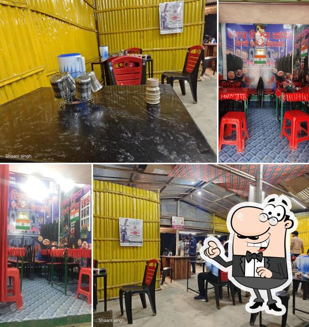 Take a seat at one of the tables at Faraz chicken Biryani