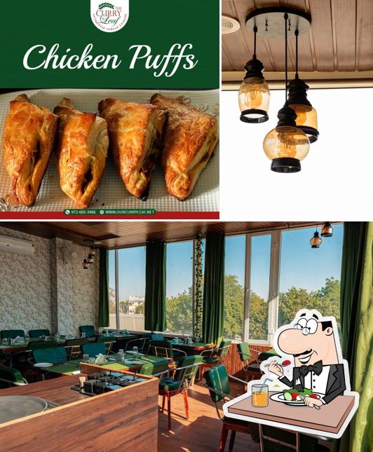 This is the image displaying food and interior at The Curry Leaf