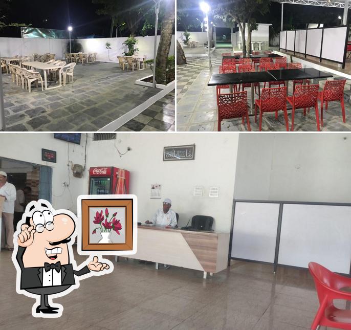 Take a seat at one of the tables at TAJ DHABA (Family Restaurant)