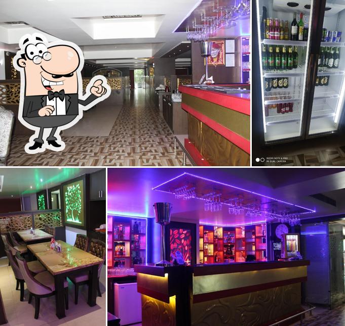 Take a seat at one of the tables at Oak Grove - Best Lounge Bar in Ranchi