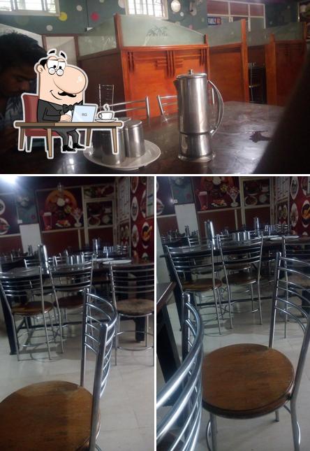 Take a seat at one of the tables at Malika Hotel