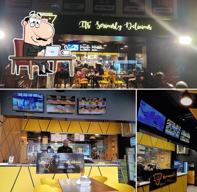 Take a seat at one of the tables at Al Taza - Alappuzha