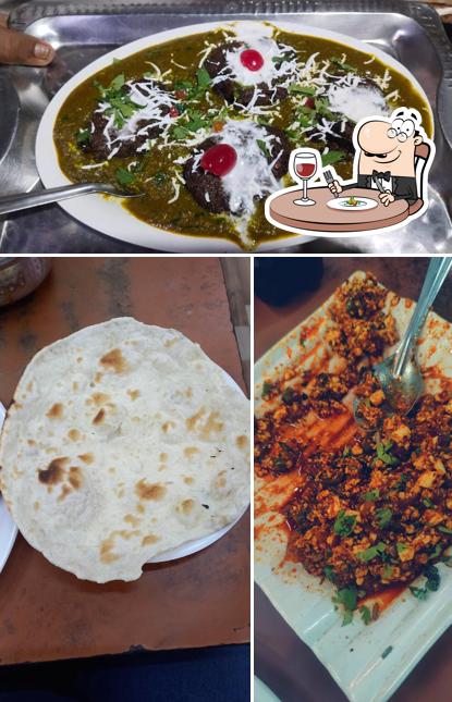 Take a look at the image displaying food and exterior at Amol restaurant and lodging