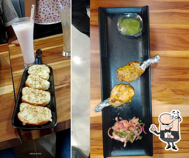 Take a seat at one of the tables at Tandoori Kitchen