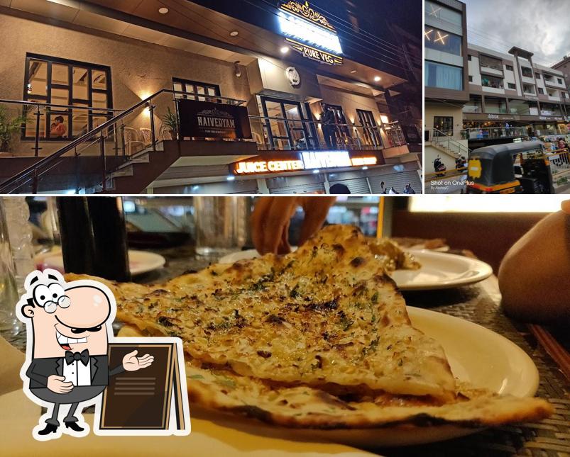 Among various things one can find exterior and pizza at Hotel Naivedyam