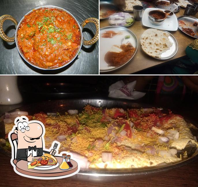 Try out pizza at Prarthana Family Restaurant & Bar
