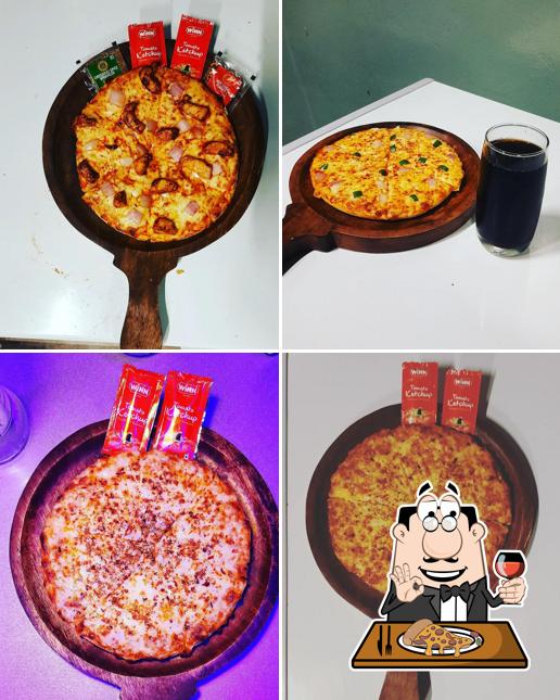 Get pizza at Club Cafe