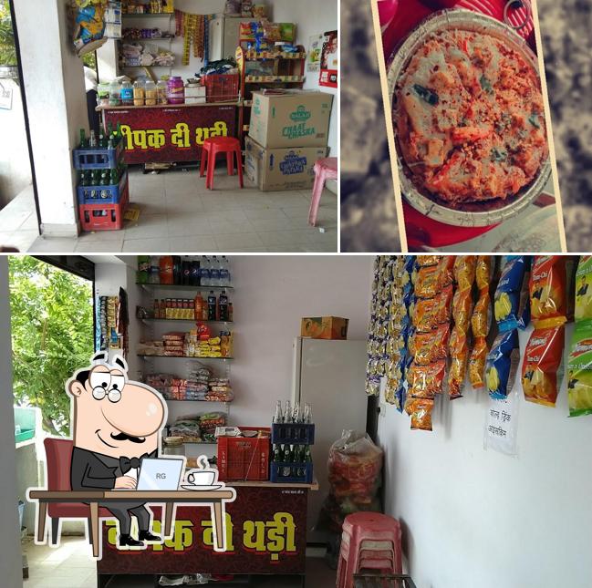 This is the picture showing interior and pizza at Deepu di Thadi