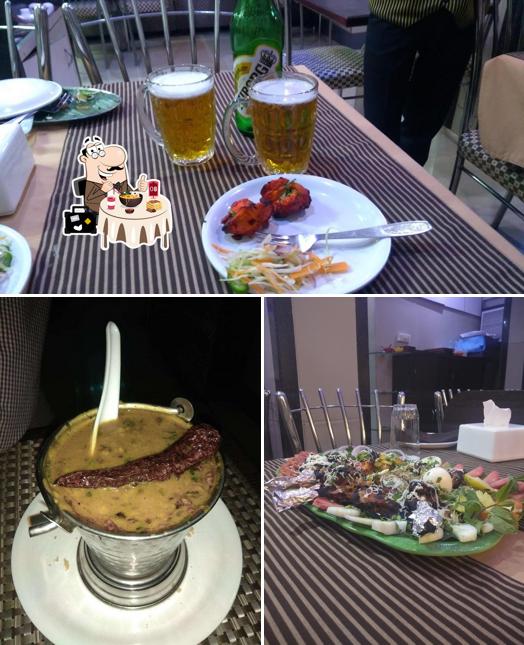 The picture of food and beer at Sai Leela Hotel