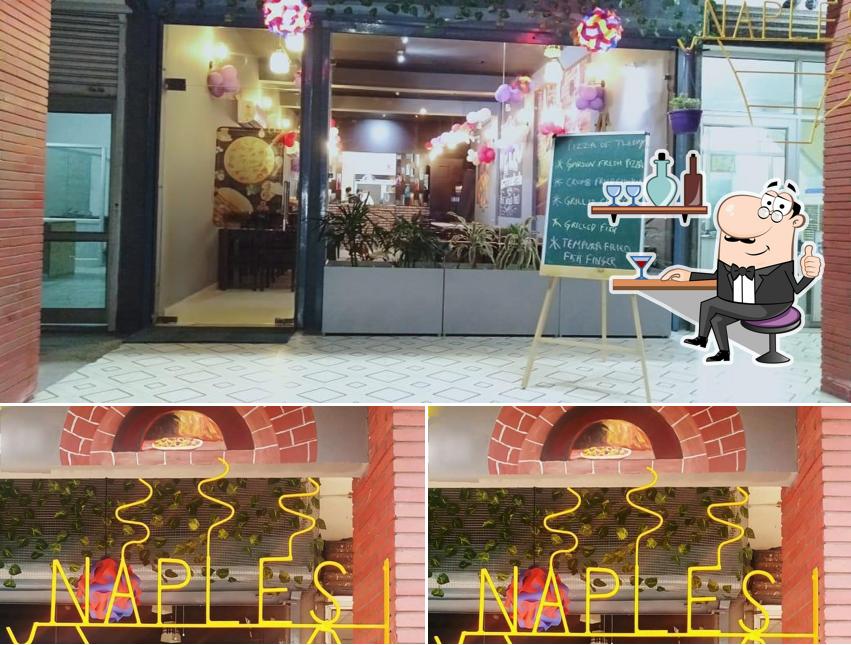 Take a seat at one of the tables at Naples Authentic Italian Cafe & Restro (Bathinda)
