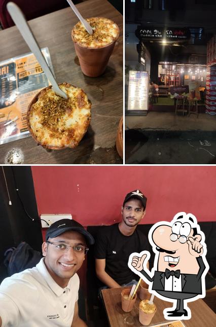 Check out the picture depicting interior and food at Chai Sutta Bar