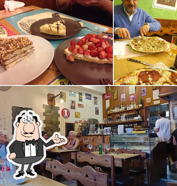 Questa è la immagine che mostra la interni e tavolo da pranzo di La Pizza di Egizio