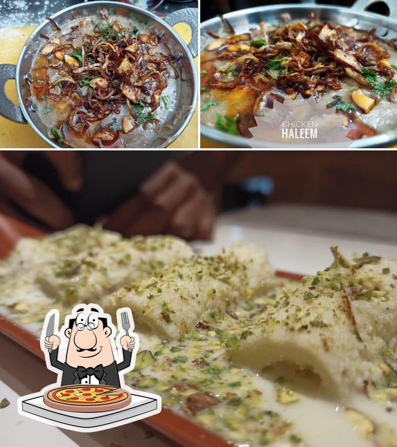 Get pizza at POLIMERAS RESTAURANT