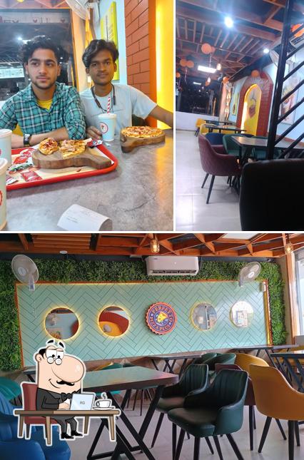 The interior of Perfetto Pizza Plus, Vikasnagar