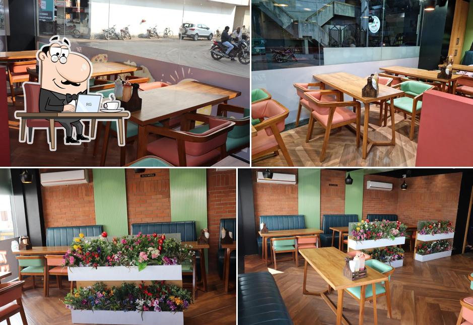 Take a seat at one of the tables at La Pino'z Pizza Amreli