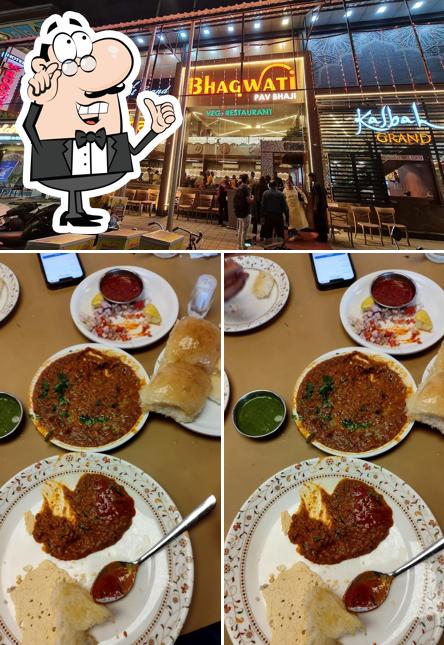 Take a seat at one of the tables at Bhagwati Veg Resturant