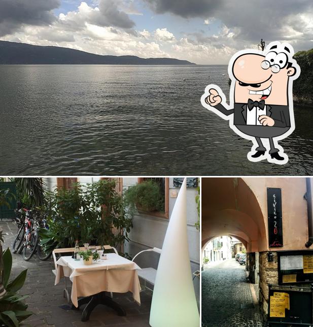 La immagine di esterno e tavolo da pranzo da osteria civico 20