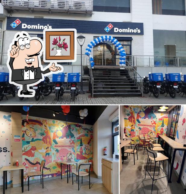 Take a seat at one of the tables at Domino's Pizza