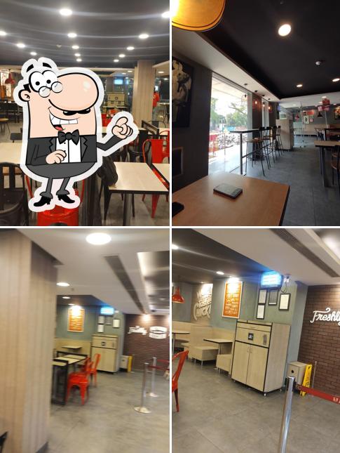 Take a seat at one of the tables at KFC