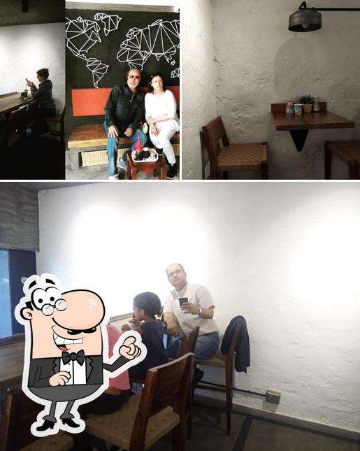 Take a seat at one of the tables at The Little Coffee Shop