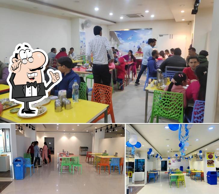 Take a seat at one of the tables at Khatu Ji Vaishnu Dhaba