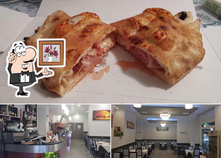 La immagine di interni e cibo da Le Coralline Ristorante Pizzeria