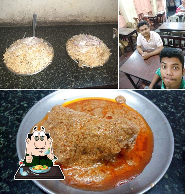 This is the image showing food and dining table at Khaza Biryani Centre