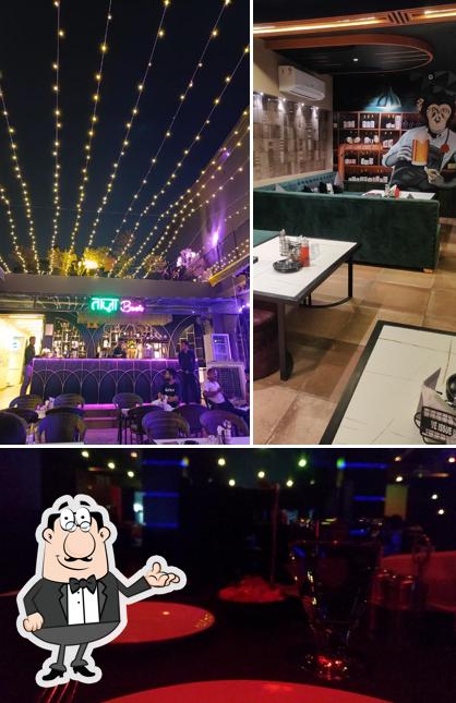 Take a seat at one of the tables at SHEESHA Brew & Kitchen