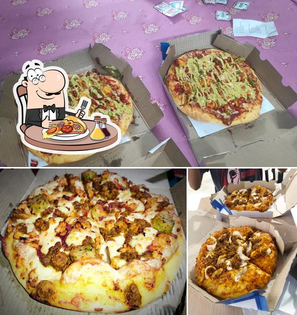 Pick pizza at Domino's Pizza Bandhgora, Bolpur